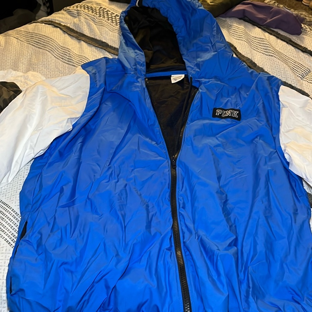 I’m selling: Used ladies windbreaker style PINK jacket with Pink on both sleeves